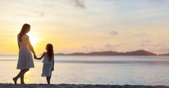 mother and child on beach